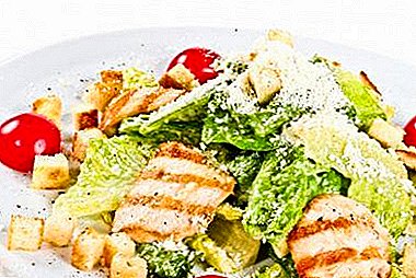 Classic Caesar Salad with Peking Cabbage, Crackers, Chicken and Tomatoes and Other Ingredients